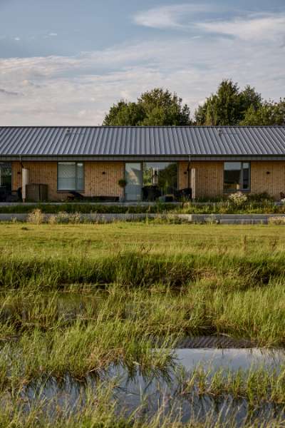 Past and future meet in steel-clad terraced houses with history in the backyard, Jernaldervej 8, 8600 Silkeborg, Denmark